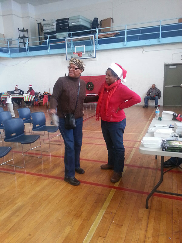 Volunteers Yalinda and Sharyn assess the day's activities.